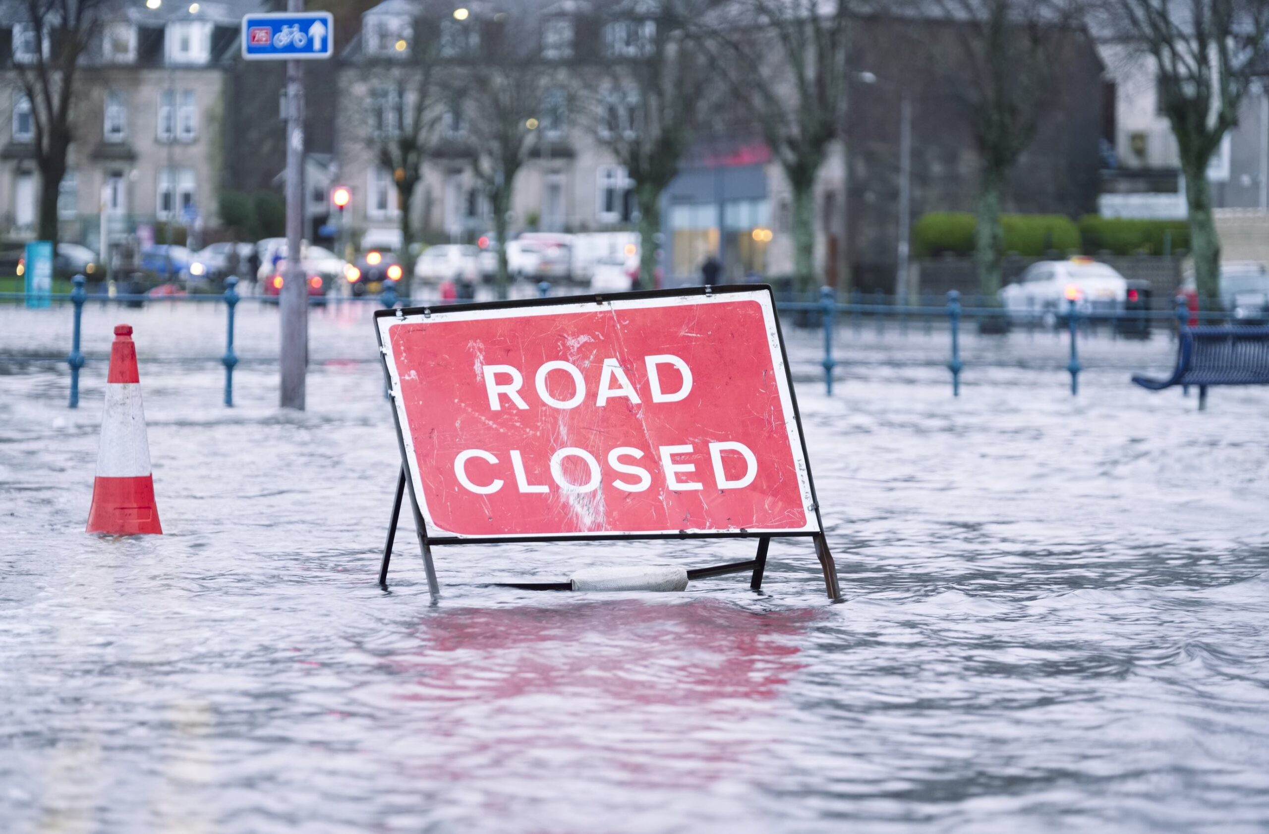 Coastal storm causes flash flooding in NYC 2 A "Road Closed" sign in the middle of a flooded street.