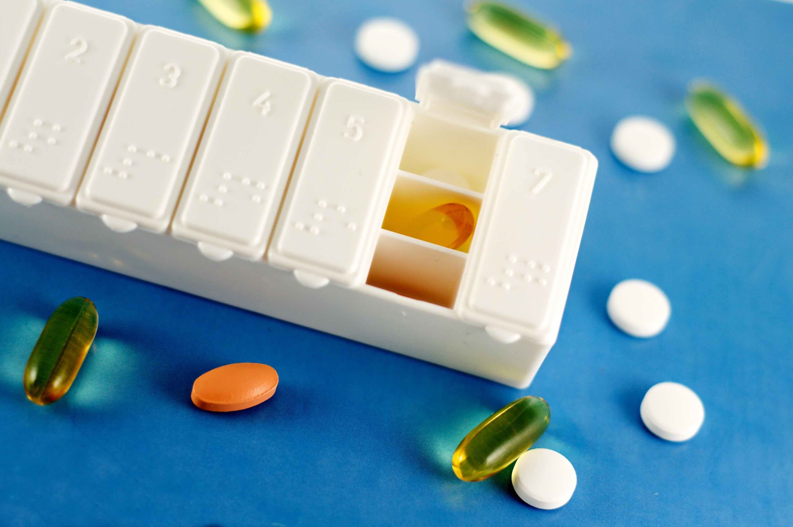 Florida Can Now Import Prescription Drugs from Canada, Will That Lower Prices? 6 A pill organizer with pills strewn around it.