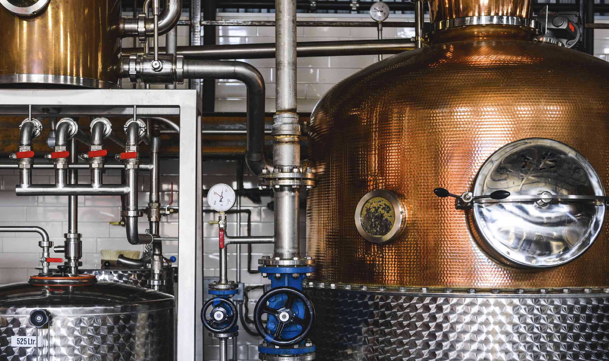 Production of distilled spirits is fraught with risk 12 Distilling equipment inside of a distillery.