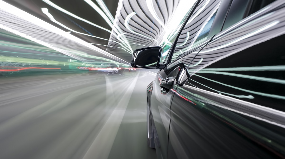 U.S. lawmakers revisit regulations for autonomous vehicles 6 An automobile driving through a colorful tunnel.