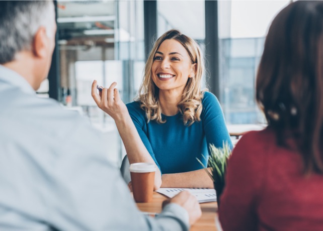 A smiling employee in an interview.